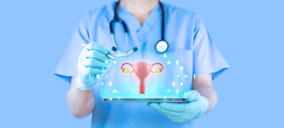 Medical professional holding tablet