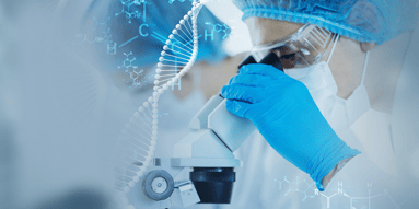 Scientist looking into a microscope